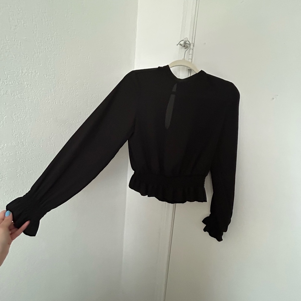 Sheer black women’s top